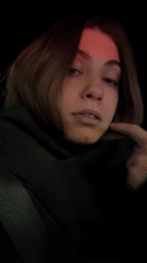 Woman in car passenger seat observed in Moscow evening