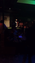 Night club scene with pool table and colorful lighting