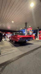 Vintage red car spotted at Riga gas station