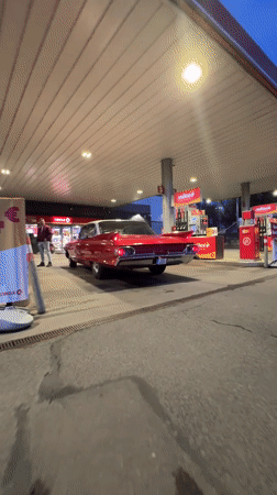 Vintage red car spotted at Riga gas station