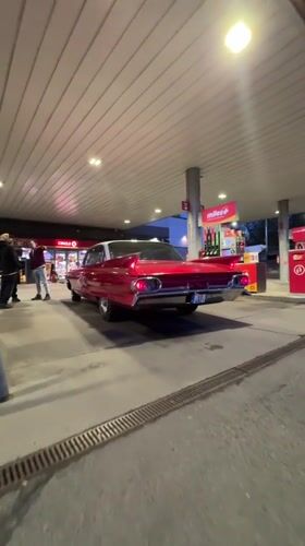 Vintage red car spotted at Riga gas station