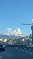 Highway travel documented in Sirius, Russia with motorcyclist present
