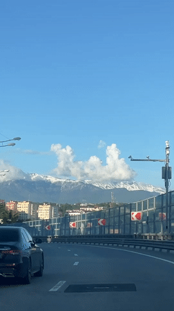 Highway travel documented in Sirius, Russia with motorcyclist present