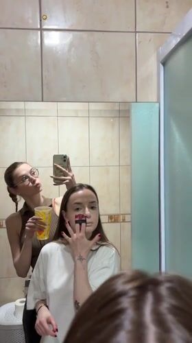 Women Apply Makeup, Take Selfies in Kragujevac Bathroom