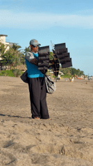 Morning beach scene with kite vendor in North Kuta