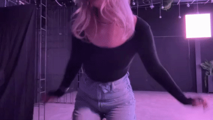 Woman photographed in neon-lit venue in Tbilisi