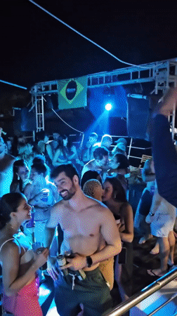 Night festivities and beach activities captured in Búzios, Brazil