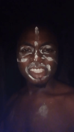 Cultural gathering with face paint, children documented in Ogidi