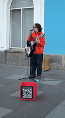Street musician performs guitar set on Saint Petersburg sidewalk