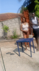 Two people gather at outdoor table in Lagos