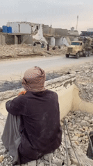 Demolition work continues amid rubble in Kandahar, Afghanistan