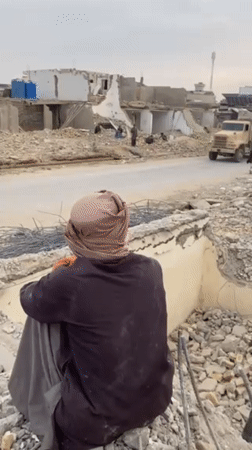 Demolition work continues amid rubble in Kandahar, Afghanistan