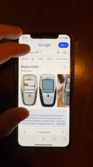 Masked patron searches vintage phones at Sofia establishment