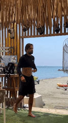 Poodle holds down the counter at a Cyprus beach rental shack