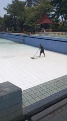 Drained pool gets a morning clean-up at Sombron facility