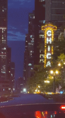 Late-night traffic captured near Chicago Theatre downtown