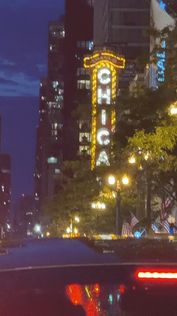 Late-night traffic captured near Chicago Theatre downtown