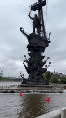Tourists visit Peter the Great monument in Moscow