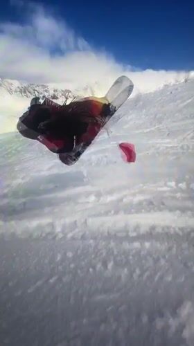Snowboarder in red jacket descends slope near Villeurbanne