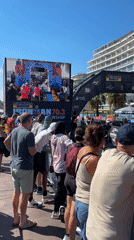 HOKA race event on a sunny seaside promenade