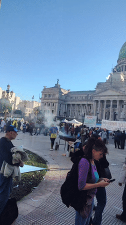 Protesters gather with banner in Buenos Aires demonstration