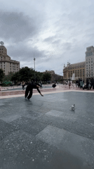Street performers entertain crowds in Barcelona plaza afternoon