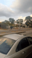Routine street scenes documented across Caracas during evening hours