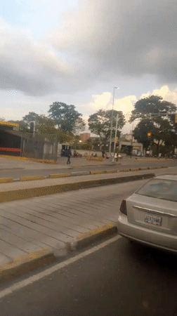 Routine street scenes documented across Caracas during evening hours
