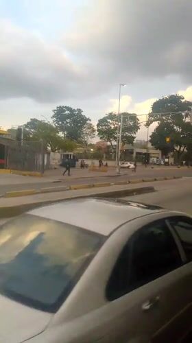 Routine street scenes documented across Caracas during evening hours