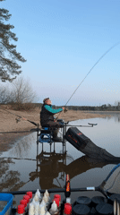 Angler fishes during sunset at Chaykovsky waterway