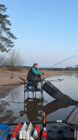 Angler fishes during sunset at Chaykovsky waterway