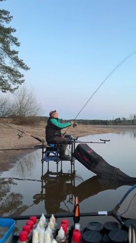 Angler fishes during sunset at Chaykovsky waterway