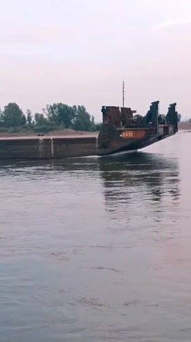 Tugboat PT-800 and rafters share the Yenisei River in Krasnoyarsk