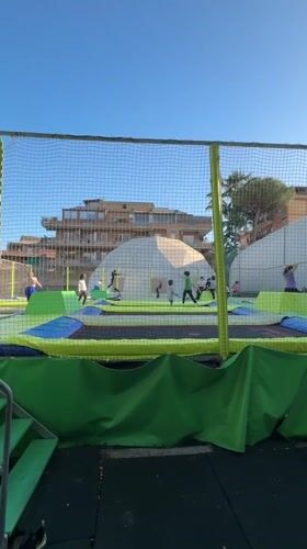 Children play at outdoor trampoline park in Rome