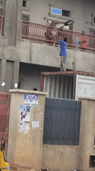 Man throws bricks from shipping container in Nigeria