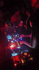 Female DJ performs at illuminated Paris nightclub early Sunday
