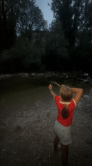 Slingshot practice on a calm riverbank in Saint-Claude