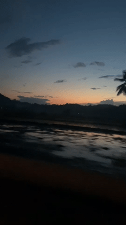Twilight scene captured from vehicle in Uleejalan, Indonesia
