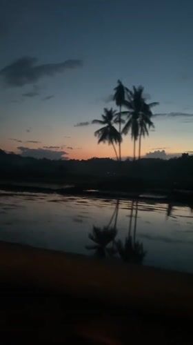 Twilight scene captured from vehicle in Uleejalan, Indonesia