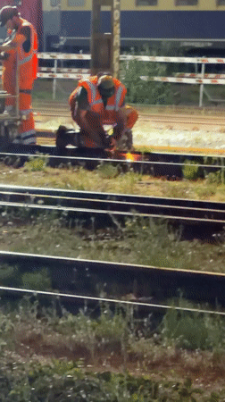 Nighttime excavator work on Mönchengladbach railway tracks