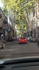 Dashcam views of Tbilisi traffic with a red double-decker bus