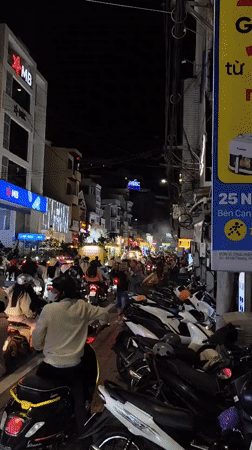 Buddhist parade with illuminated floats draws crowds in Da Lat