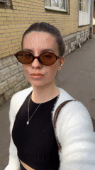 Woman Takes Selfie Video on Klin Sidewalk
