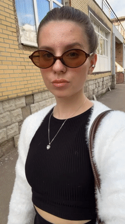 Woman Takes Selfie Video on Klin Sidewalk