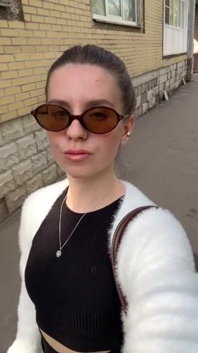 Woman Takes Selfie Video on Klin Sidewalk