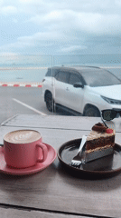 Morning breakfast documented at oceanfront cafe in Nathon, Thailand