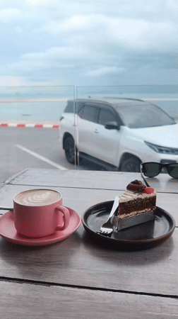 Morning breakfast documented at oceanfront cafe in Nathon, Thailand