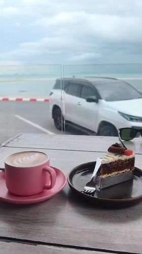 Morning breakfast documented at oceanfront cafe in Nathon, Thailand