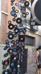 Vinyl records decorate a street corner in Rubí, Spain