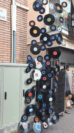 Vinyl records decorate a street corner in Rubí, Spain
